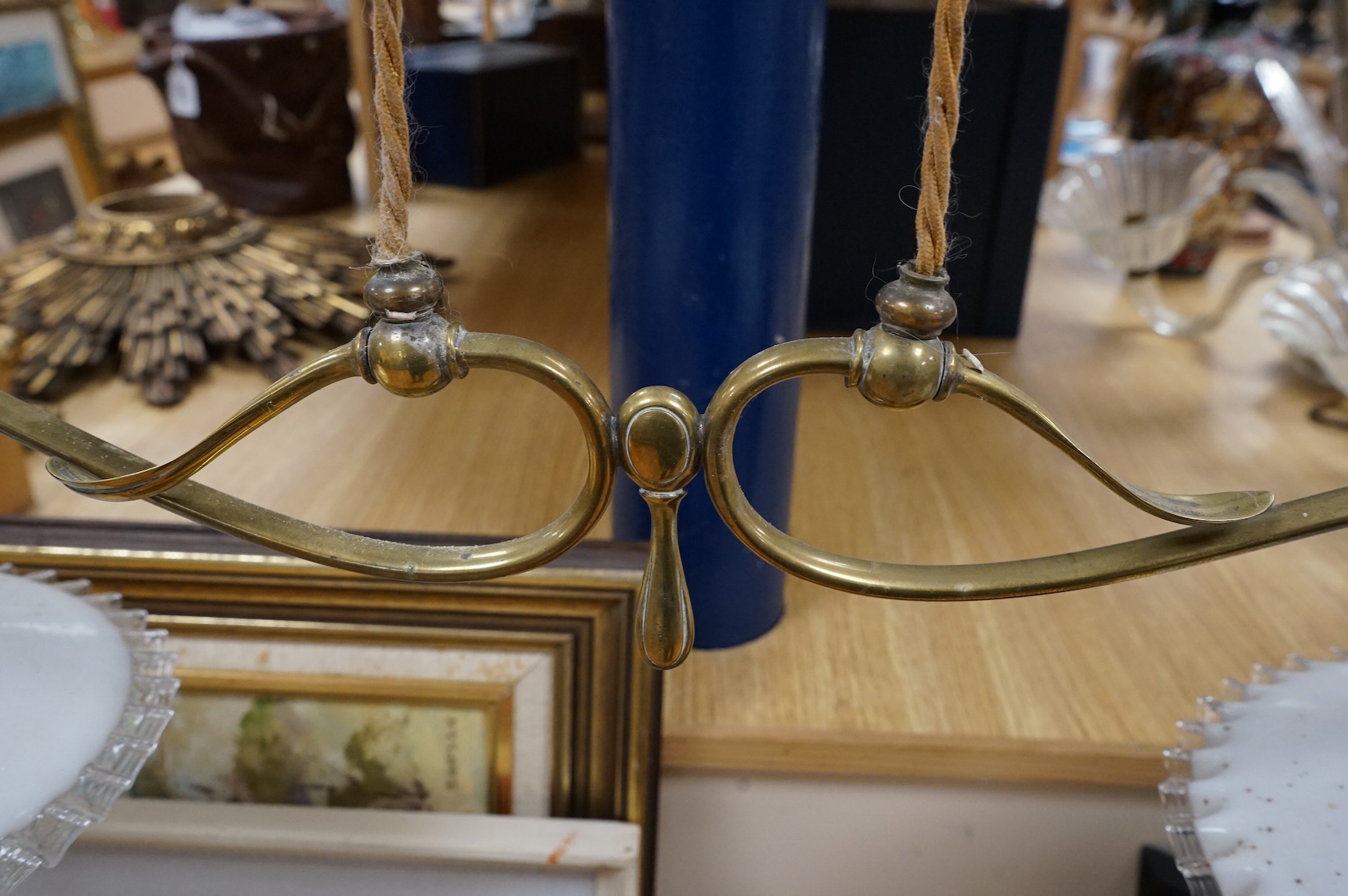 A 19th century brass two branch adjustable ceiling light, with with white glass shades, 82cm full width shade to shade
